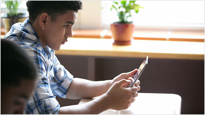 Photo of a boy using a tablet