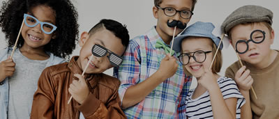 Photo of children wearing silly glasses